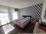 Schlafzimmer 1 im Erdgeschoss - Geräumiges Einfamilienhaus / Zweifamilienhaus – Surwold – Traumgrundstück ca. 4.695 m²