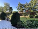 Exklusiver Walmdachbungalow mit Doppelgarage in Börger! - Blick von der Terrasse in den Garten